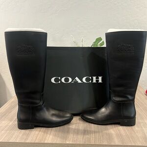 A pair of new Coach boots never been worn